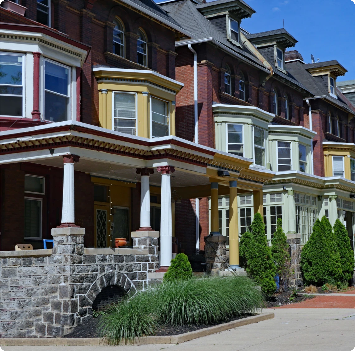 Historic row houses with stone porches.