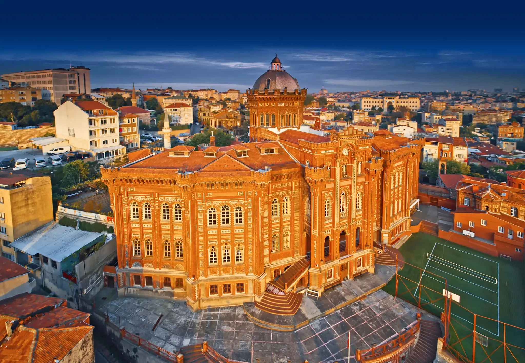 Historic red-brick building with ornate architecture.
